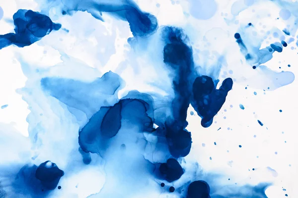 Abstract blue splashes of alcohol ink on white — Stock Photo