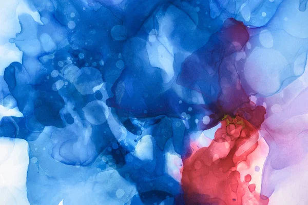 Blue, red and violet splashes of alcohol inks as abstract background — Stock Photo