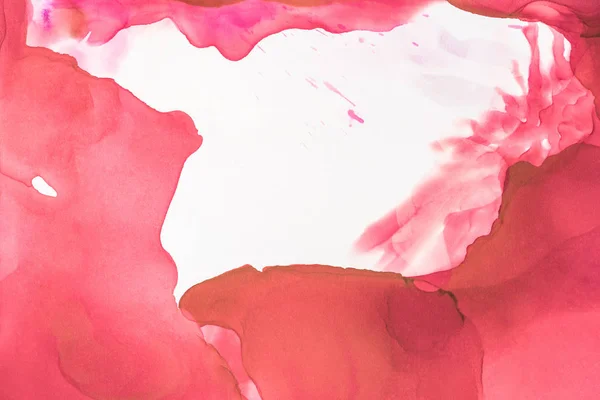 Red splashes of alcohol ink on white as abstract background — Stock Photo