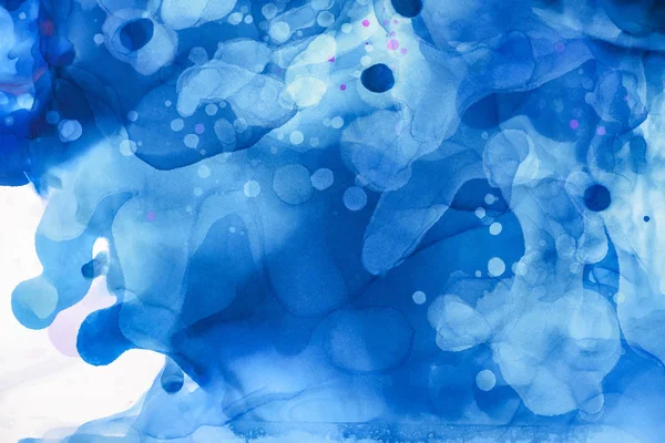 Blue splashes of alcohol ink on white as abstract background — Stock Photo