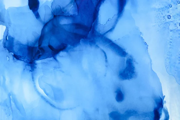 Textured blue splashes of alcohol ink as abstract background — Stock Photo