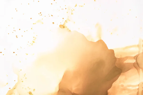 Brown splashes of alcohol ink on white as abstract background — Stock Photo