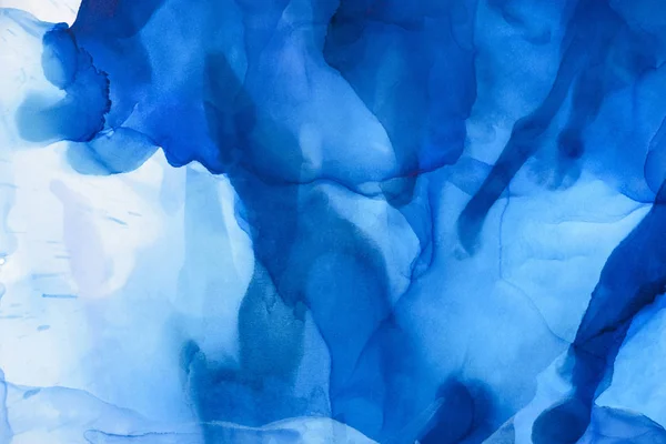 Salpicaduras azules de tinta de alcohol como fondo abstracto - foto de stock