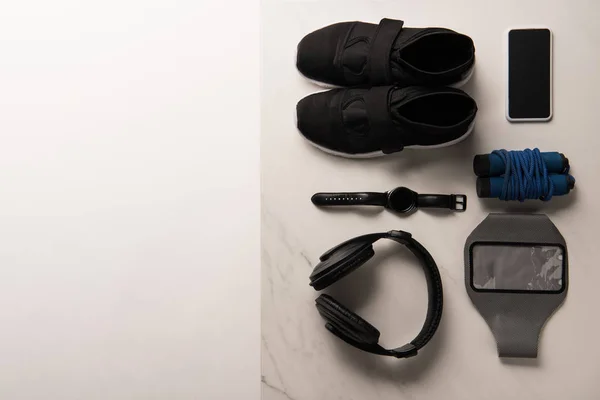 View from above of composition with gym equipment on white and marble — Stock Photo