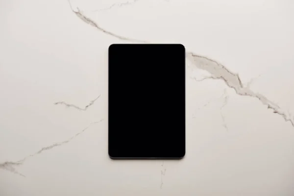 Top view of tablet on white marble surface — Stock Photo