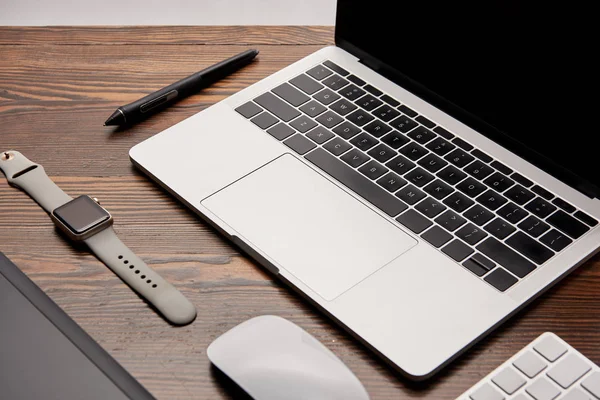 Close-up shot of graphic designer gadgets on wooden table — Stock Photo