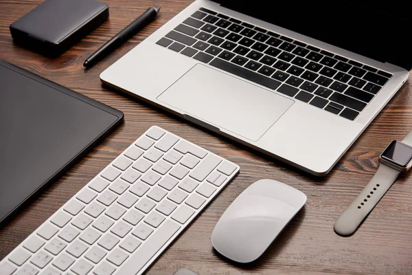 Close-up shot of different wireless gadgets on graphics designer workplace — Stock Photo