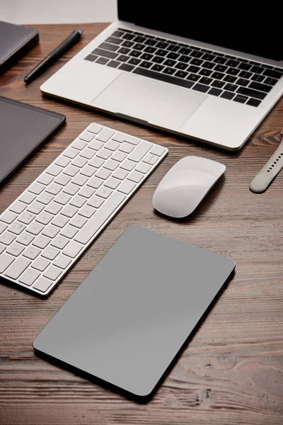 Close-up shot of various wireless gadgets on graphics designer workplace — Stock Photo