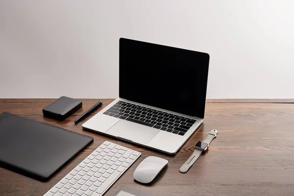 Laptop with other different gadgets on graphics designer workplace — Stock Photo