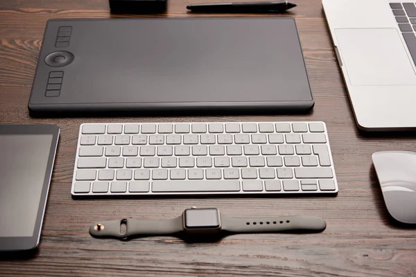 Close-up shot of different devices on graphics designer workplace — Stock Photo