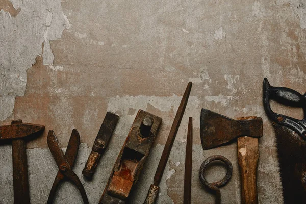 Top view of different carpentry tools on old background — Stock Photo