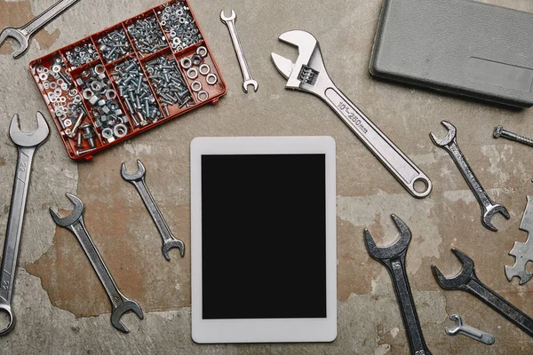 Flat lay with digital tablet and different carpentry tools on the background of old  surface — Stock Photo