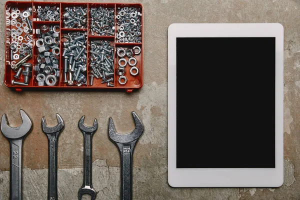 Flat lay with digital tablet and different carpentry tools  on the background of old  surface — Stock Photo