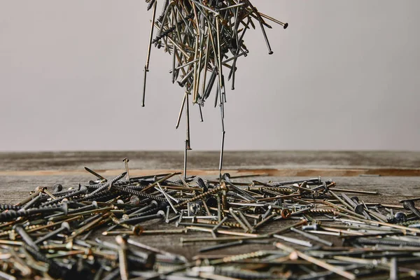 Close up of nails and screws tools on grey background — Stock Photo