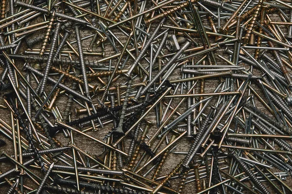 Top view of nails tools on dark wooden table — Stock Photo