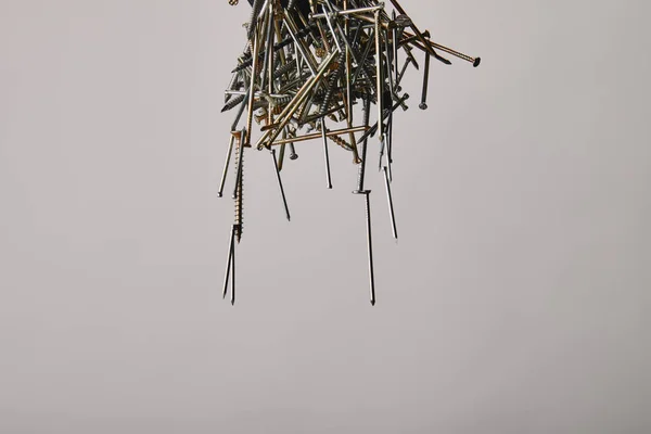 Close up of nails and screws tools on grey background — Stock Photo