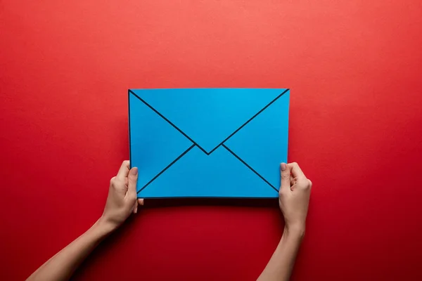 Top view of blue mail sign on red background — Stock Photo