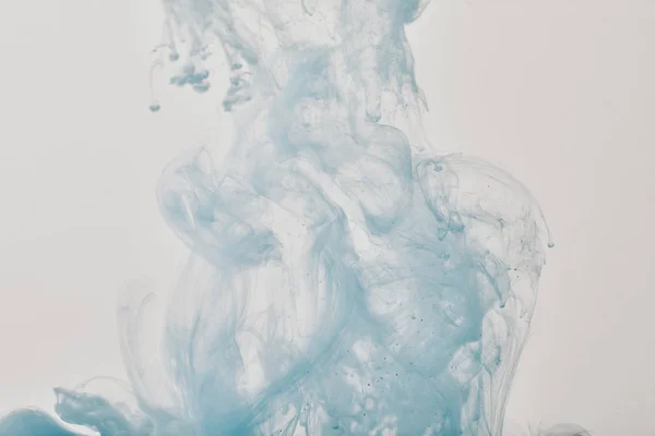 Artistic background with blue swirls of paint in water — Stock Photo