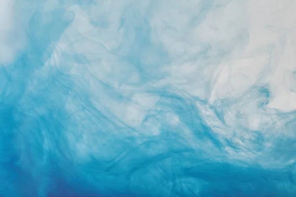 Абстрактная текстура с синей смешанной краской — стоковое фото