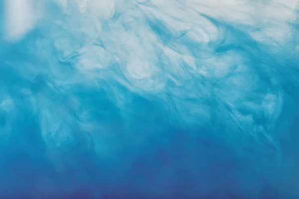 Абстрактный рисунок с синей смешанной краской — стоковое фото