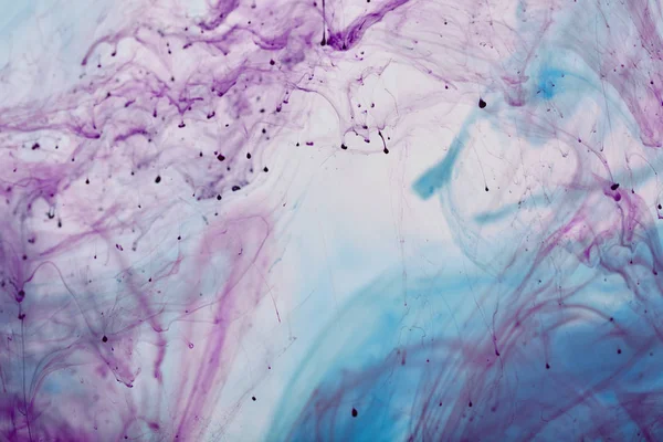Abstract texture with purple and blue mixing swirls of paint — Stock Photo