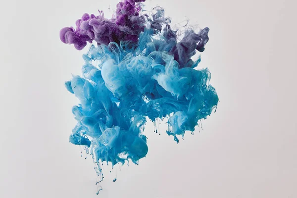 Fondo con púrpura y azul salpicadura de pintura - foto de stock