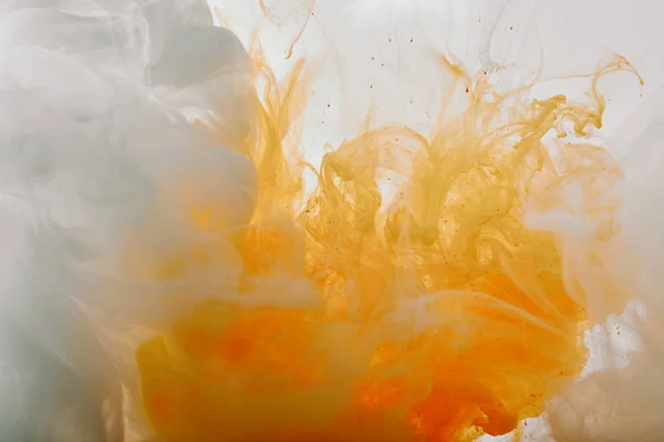 Abstract texture with white and orange swirls of paint — Stock Photo