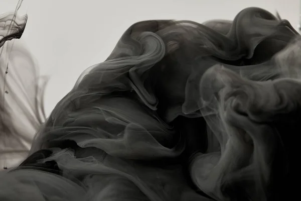 Textura abstrata com tinta misturadora preta — Fotografia de Stock