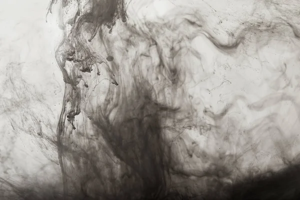 Fond fumé avec des tourbillons de peinture noire — Photo de stock