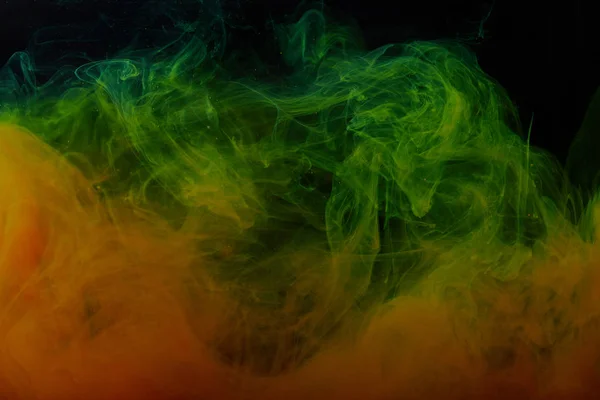 Textura com redemoinhos abstrato verde e laranja de tinta — Fotografia de Stock