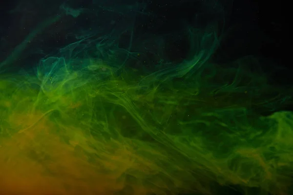 Abstract texture with green and orange swirls of paint — Stock Photo