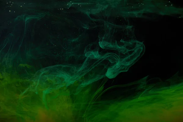 Abstract background with green swirls of paint in water — Stock Photo