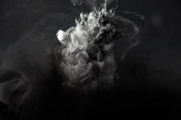 Abstract splash of grey gouache paint on black background — Stock Photo