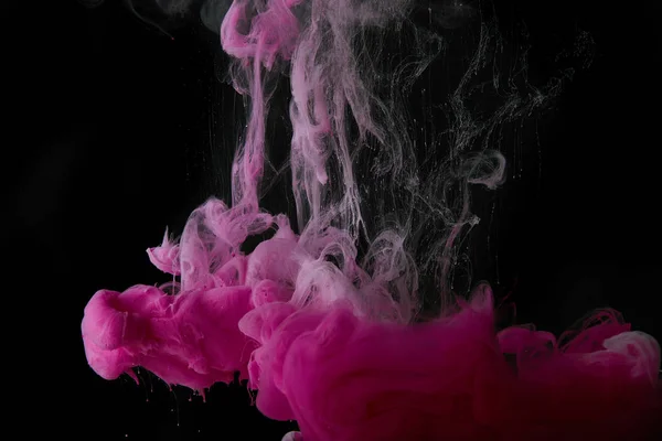 Abstract black background with pink splash of paint — Stock Photo