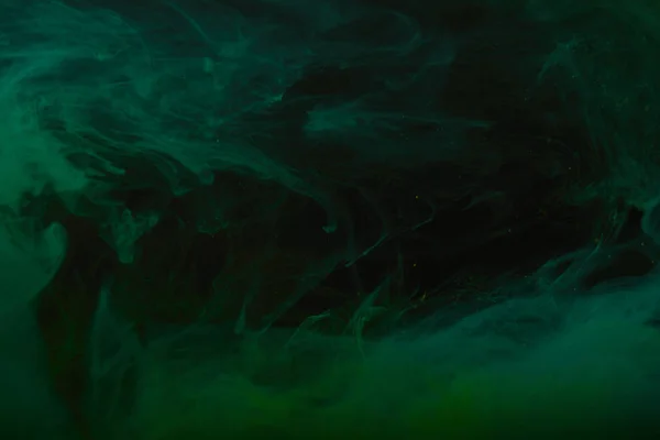 Dark texture with abstract green swirls of paint — Stock Photo