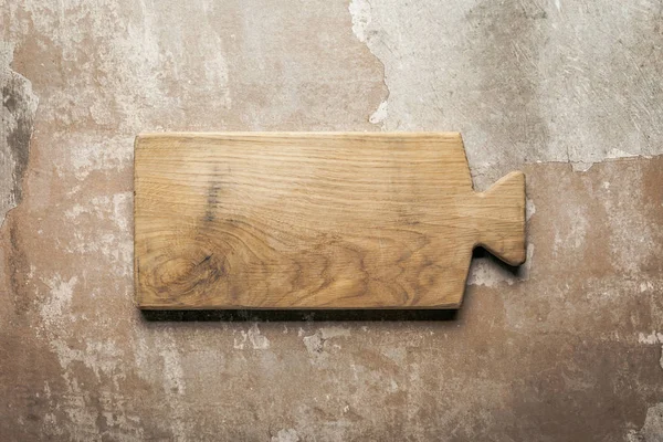 Wooden board on rustic background with copy space — Stock Photo