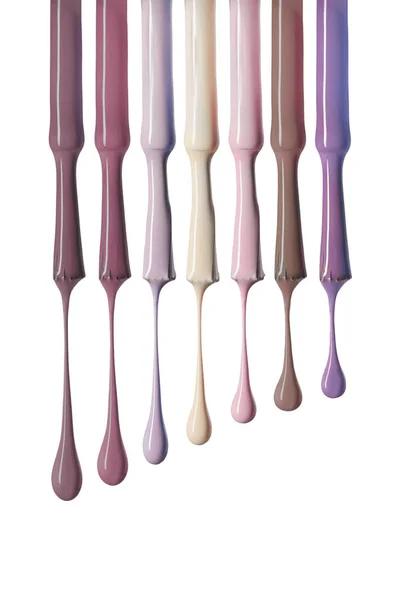 Wet brushes with variation of pastel nail polish isolated on white — Stock Photo
