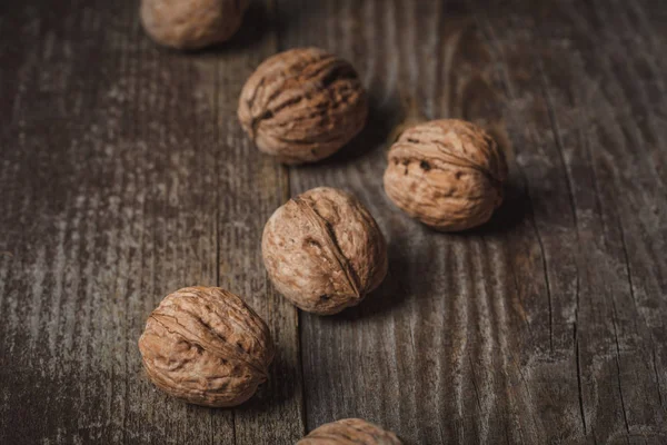 Close up view of walnuts on wooden surface — Stock Photo