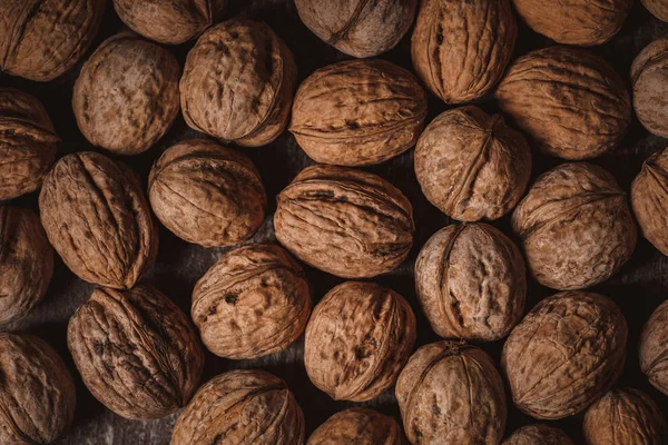 Full frame of walnuts arranged as backdrop — Stock Photo