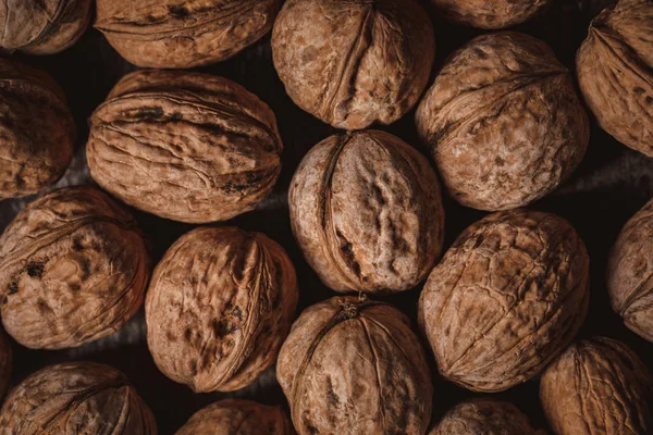 Full frame of walnuts arranged as backdrop — Stock Photo