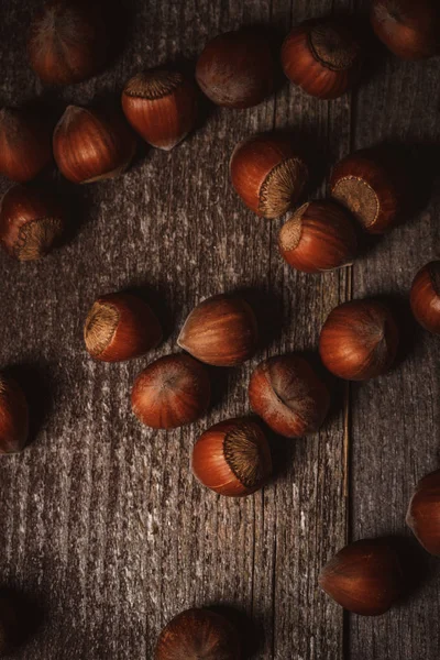 Top view of hazelnuts on wooden tabletop — Stock Photo