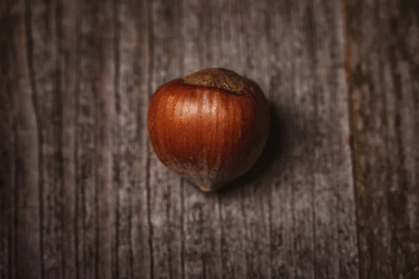 Top view of shelled hazelnut on wooden surface — Stock Photo