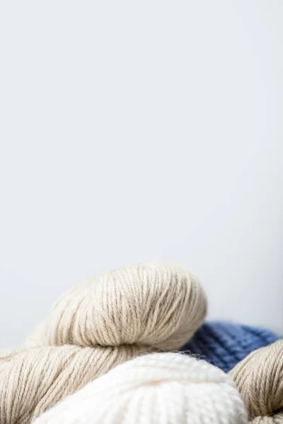 Close up view of arranged knitting clews on grey backdrop — Stock Photo