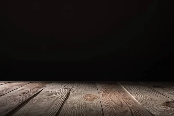 Brown striped wooden background on black — Stock Photo