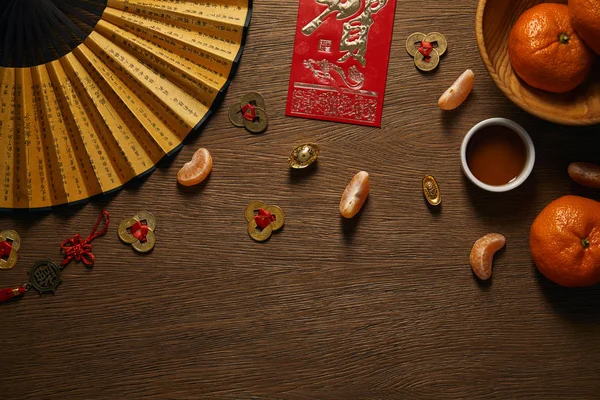 Top view of chinese new year composition on wooden surface — Stock Photo