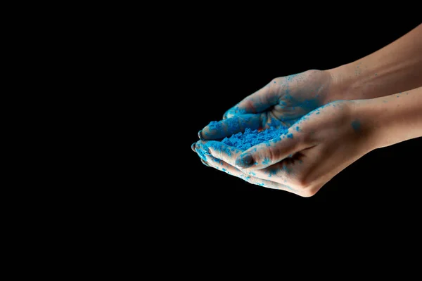 Cropped view of adult woman with blue holi powder isolated on black — Stock Photo