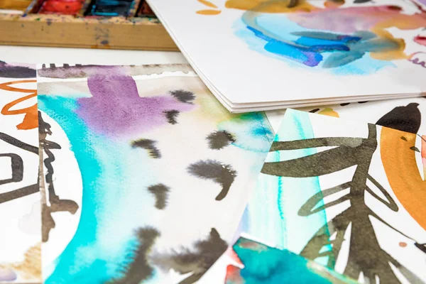 Selective focus of abstract watercolor drawings with floral print — Stock Photo