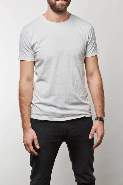 Partial view of man in white t-shirt with copy space isolated on grey — Stock Photo