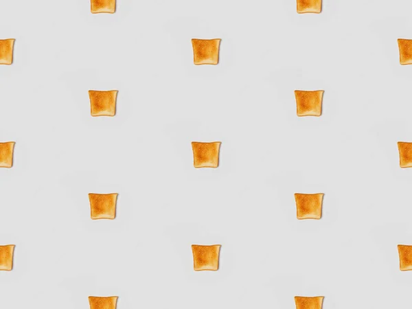 Collage of grilled crispy toasts on grey background, seamless background pattern — Stock Photo