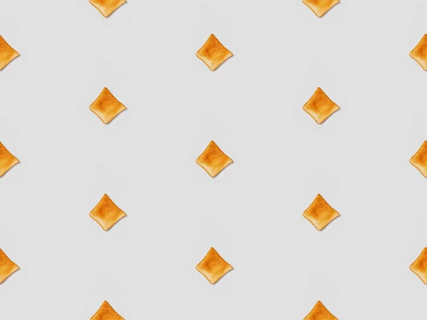 Collage of grilled crispy toasts on grey background, seamless background pattern — Stock Photo